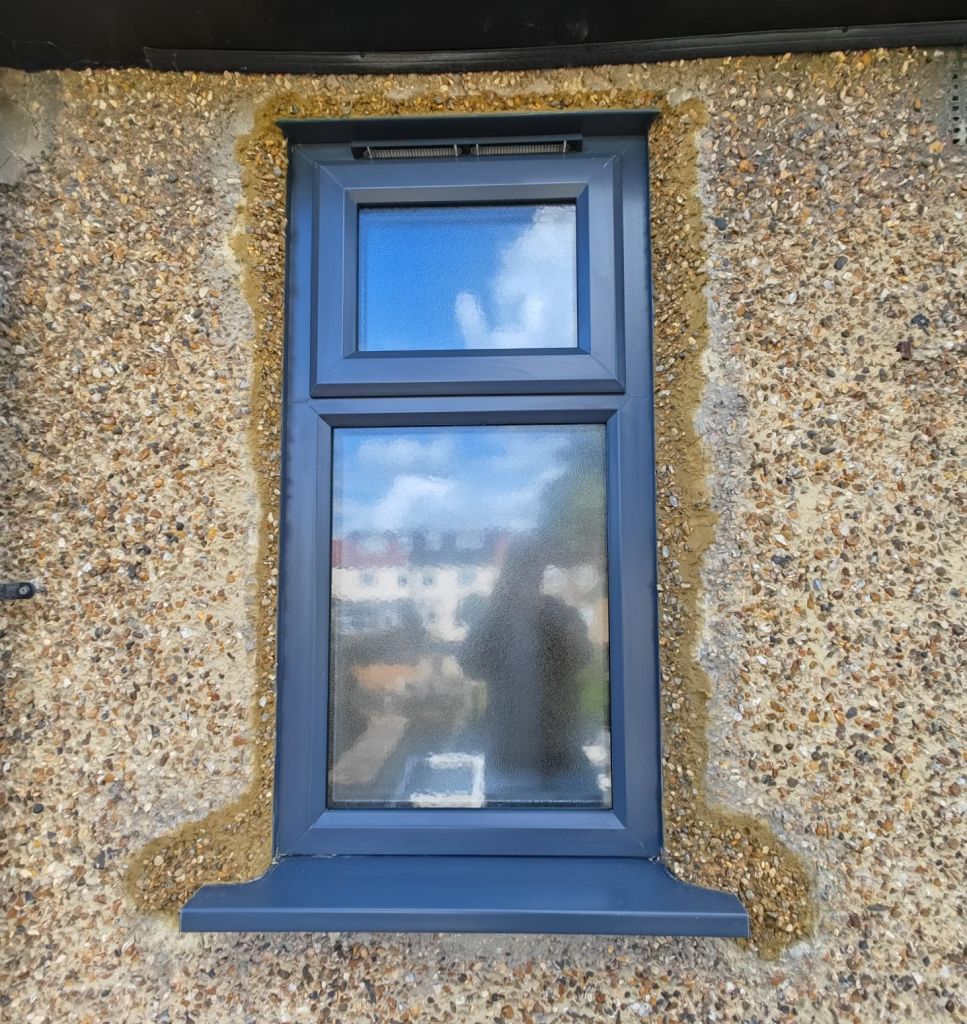 Exterior view of Anthracite Grey PVCu window with privacy glass in London