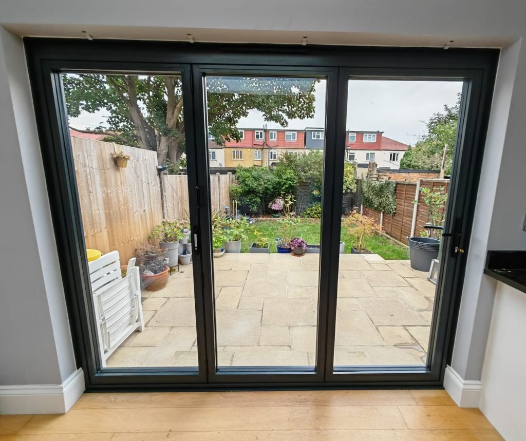 Interior view showing PVCu French doors and side panel window in a Shirley property.