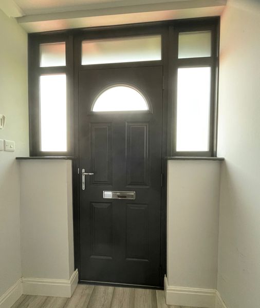 Grey Endurance composite door exterior view with satin glass side and top lights.