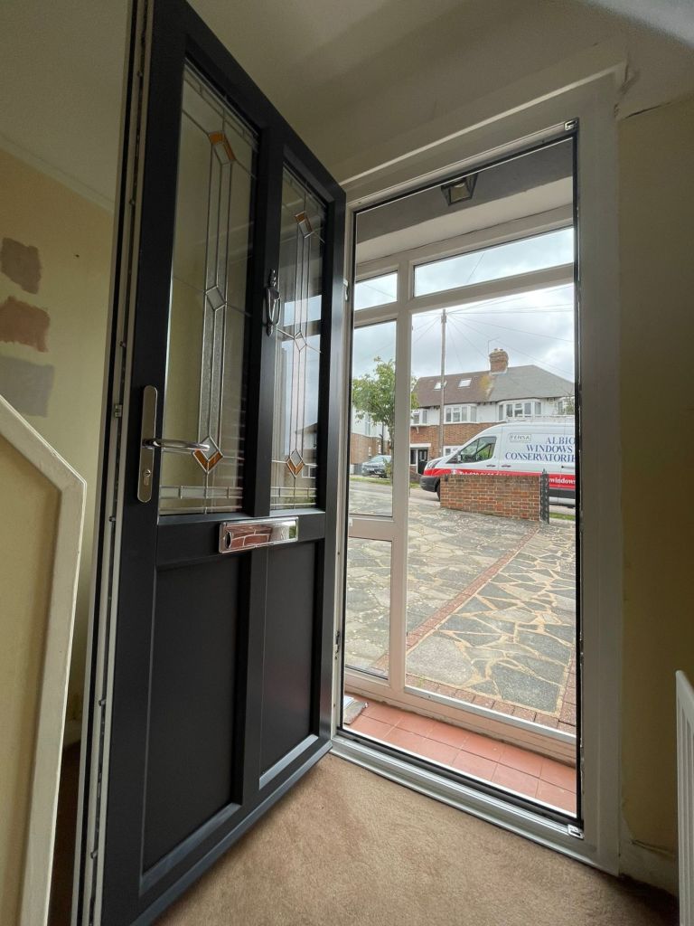 Interior view of grey and white John Fredericks Plastics Ultimate PVC-u entrance door with matching sidelight.