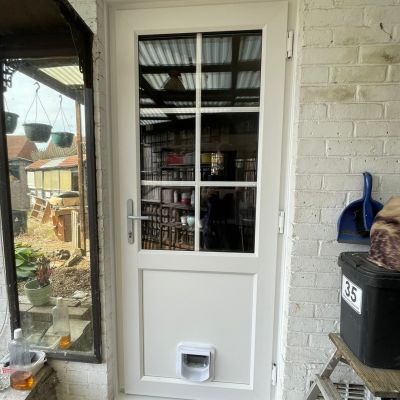 Bevelled PVCu Door with Cat Flap Installation in Croydon